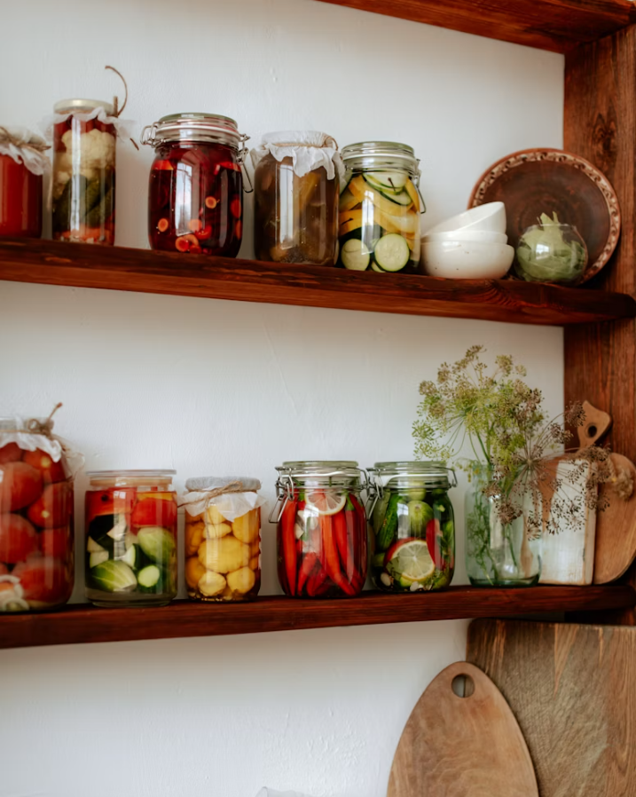 Jars of fermented vegetables on the pantry shelf