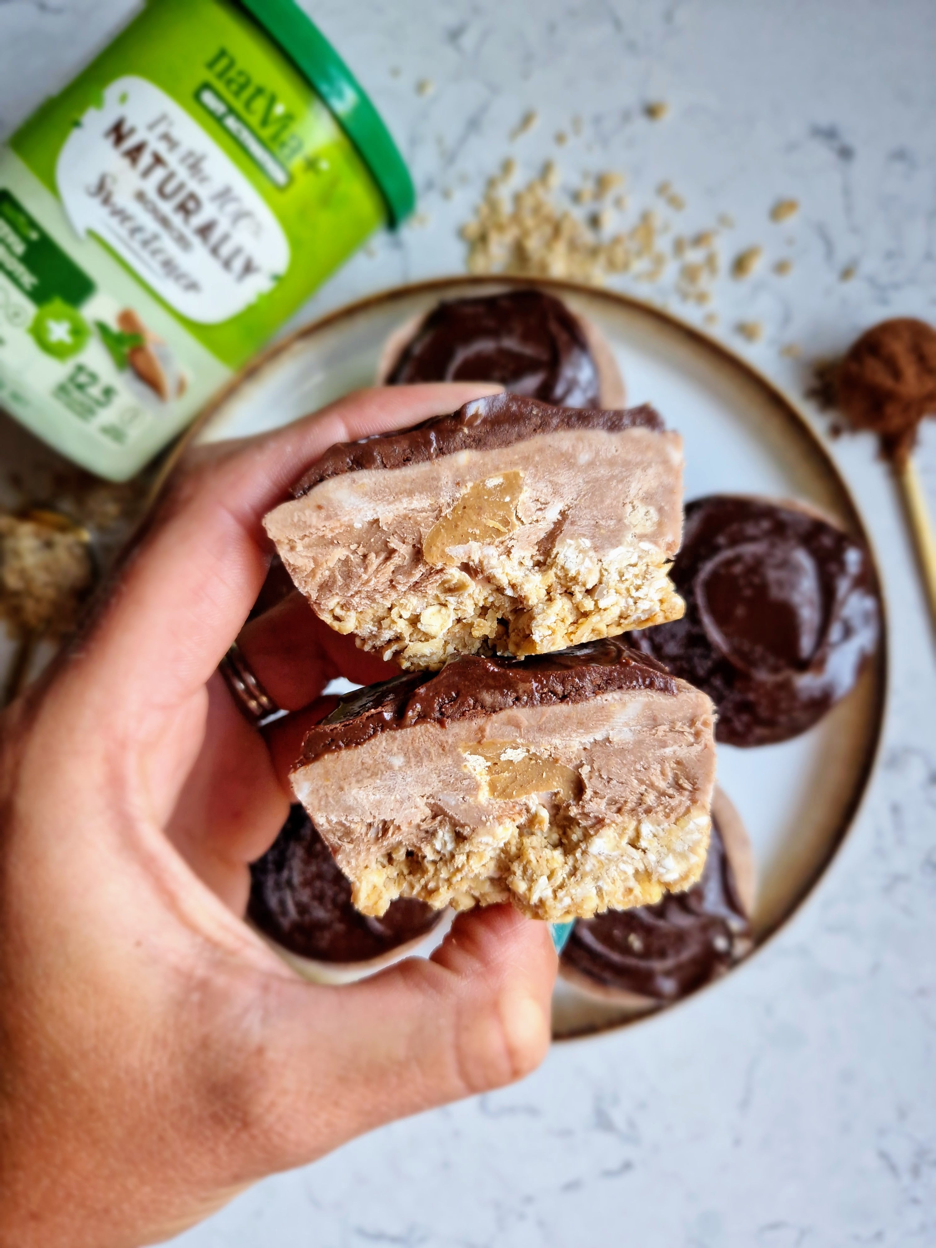 Double chocolate frozen cups layered with creamy yogurt, peanut butter, and a crunchy oat base. A refreshing snack or no-bake dessert