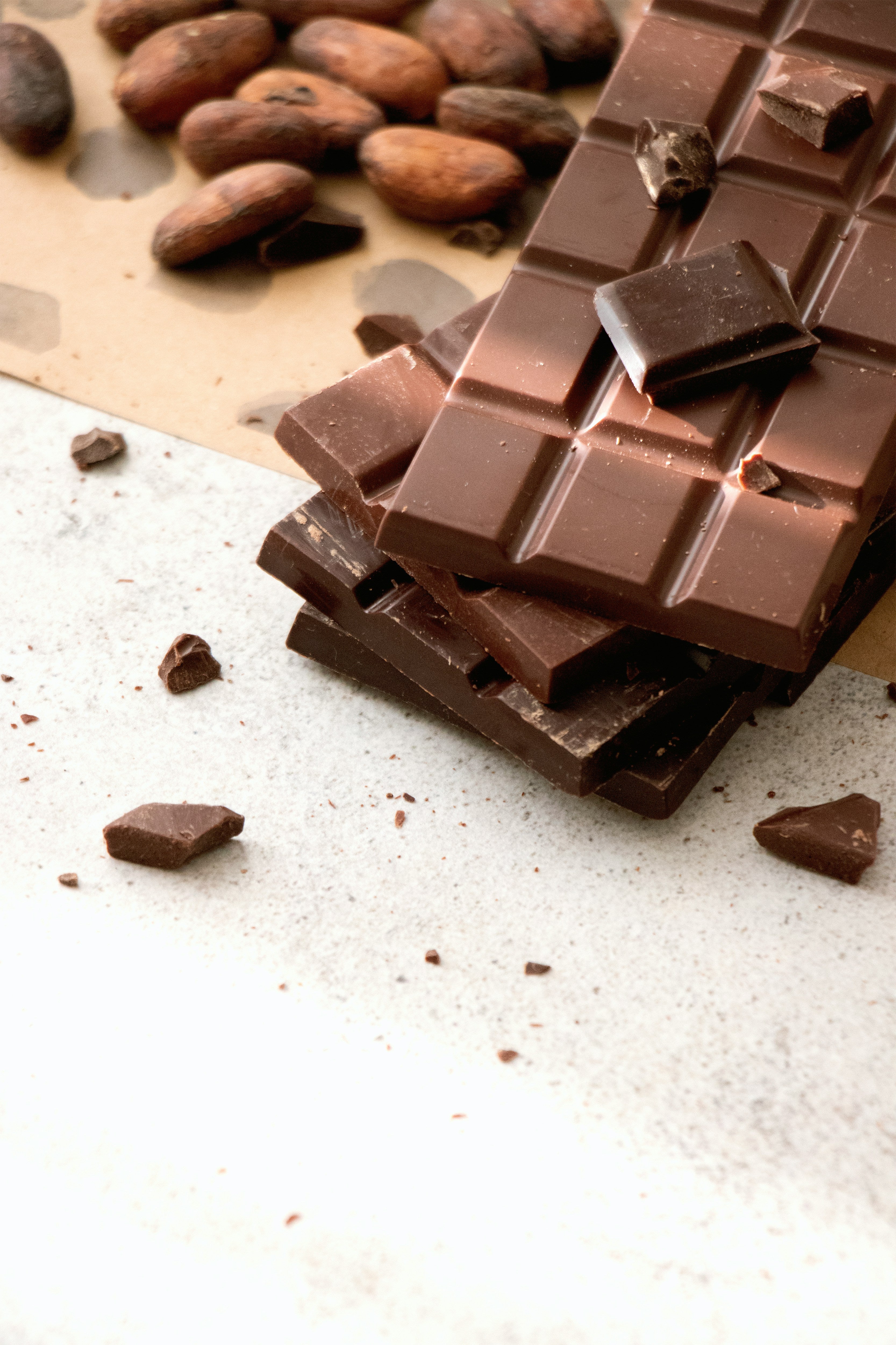 Chocolate bars next to cacao beans