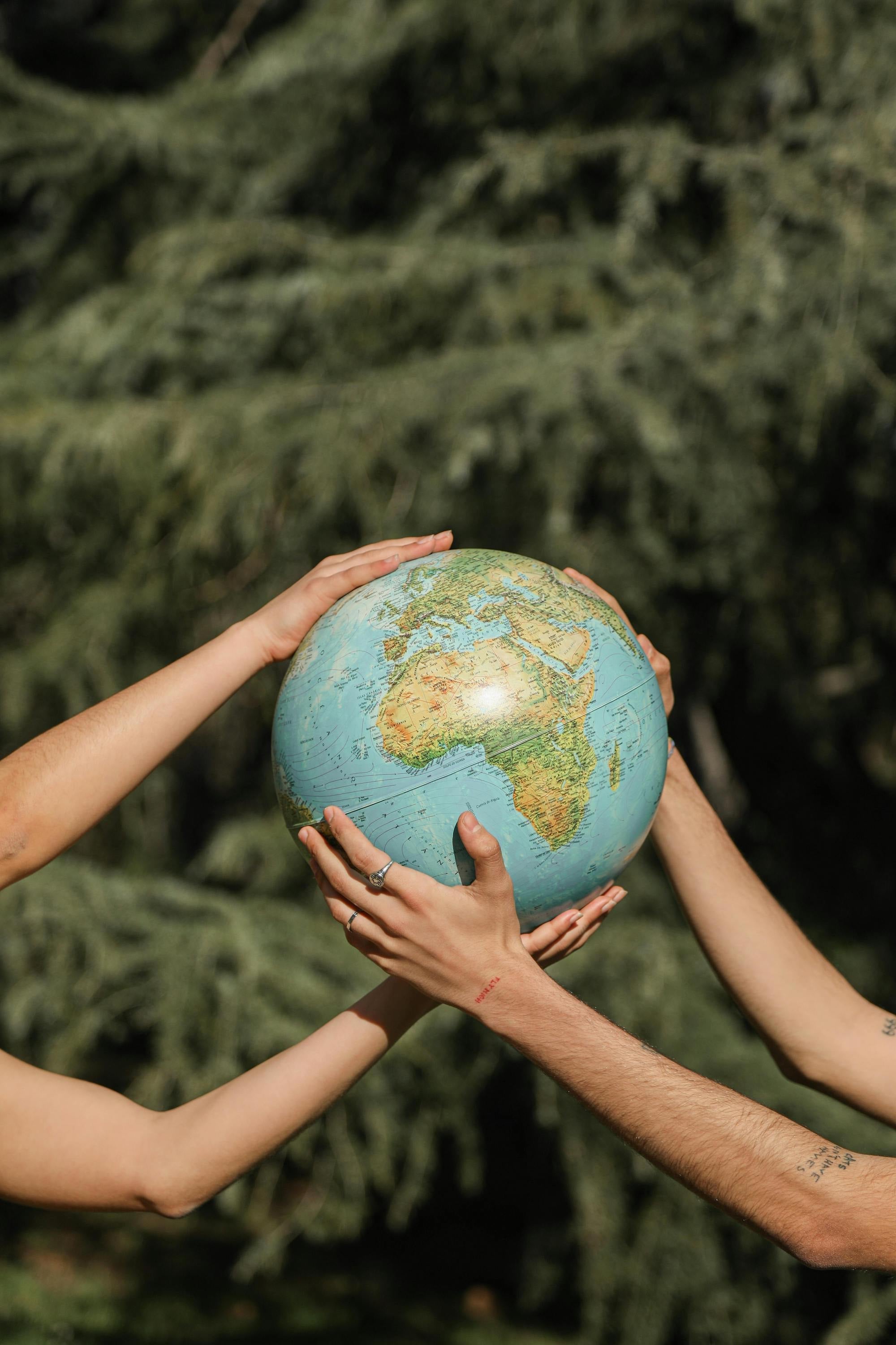 hands holding a globe of the earth 
