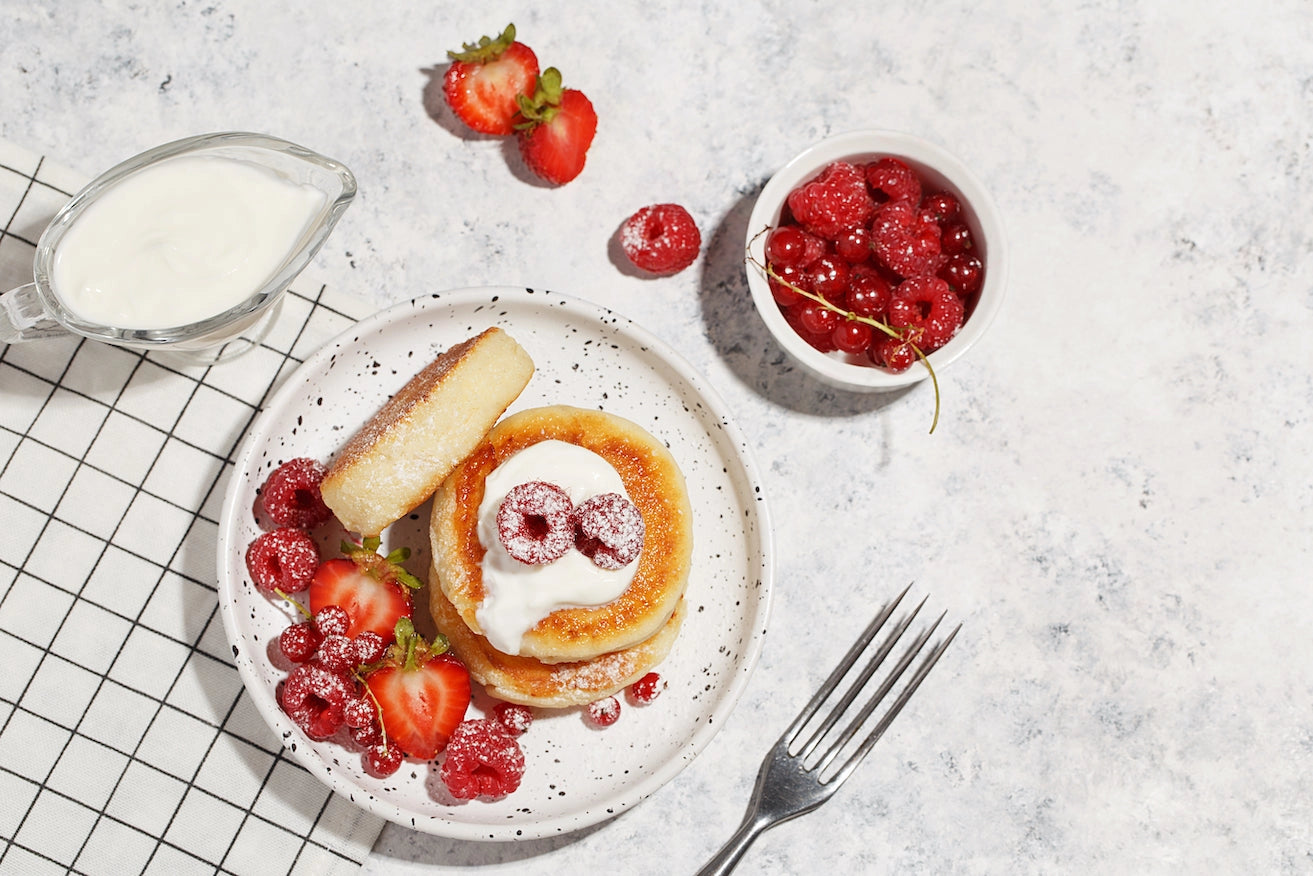 Decorative Image with pancakes, fruits, berries, strawberries and cream